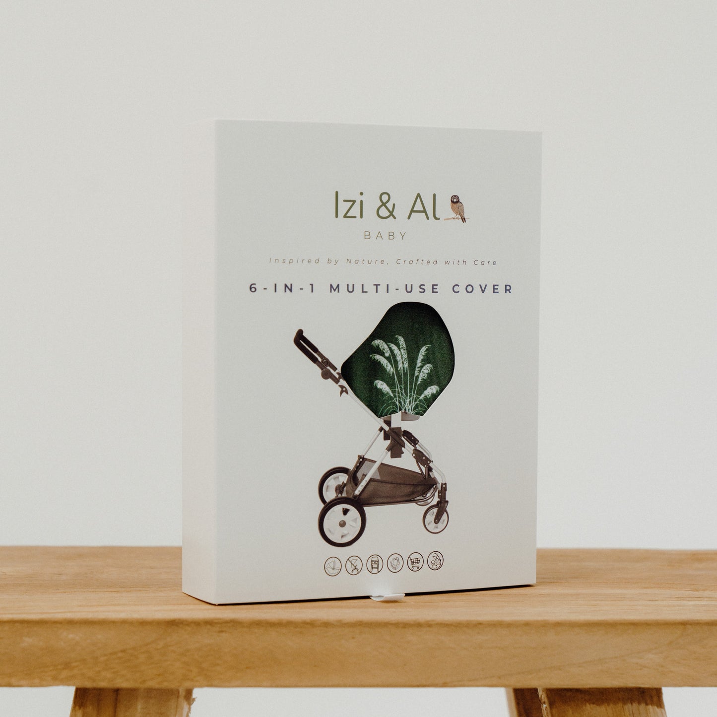 Box of Izi & Al baby product on a wooden bench with a white background