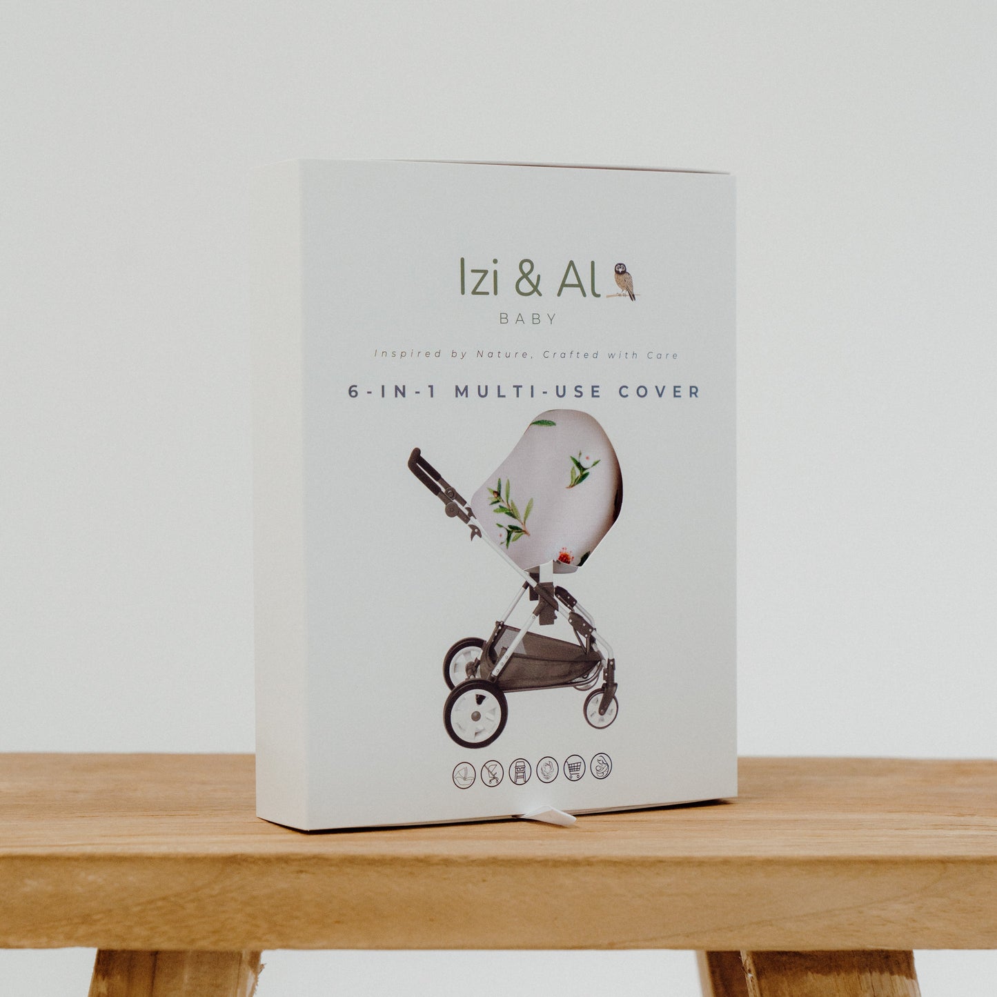 Box of Izi & AL baby product on a wooden surface with a white background