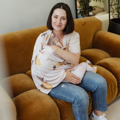 Mum breastfeeding with Owl and Mountains bamboo UPF 50+ cover by Izi & Al