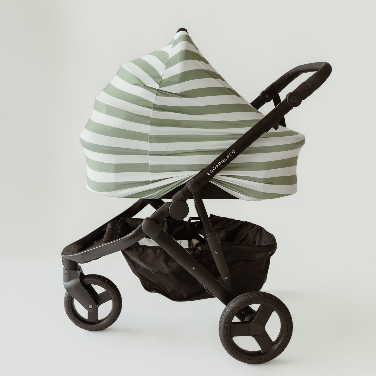 Sage Stripe bamboo UPF 50+ baby cover on a pram bassinet attachment by Izi & Al
