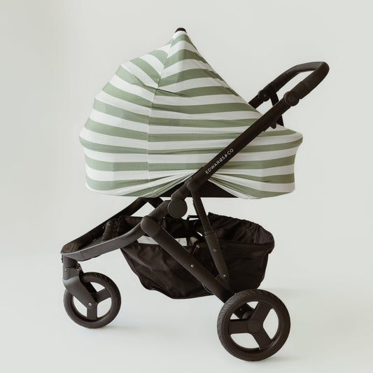 Sage Stripe bamboo UPF 50+ baby cover on a pram bassinet attachment by Izi & Al